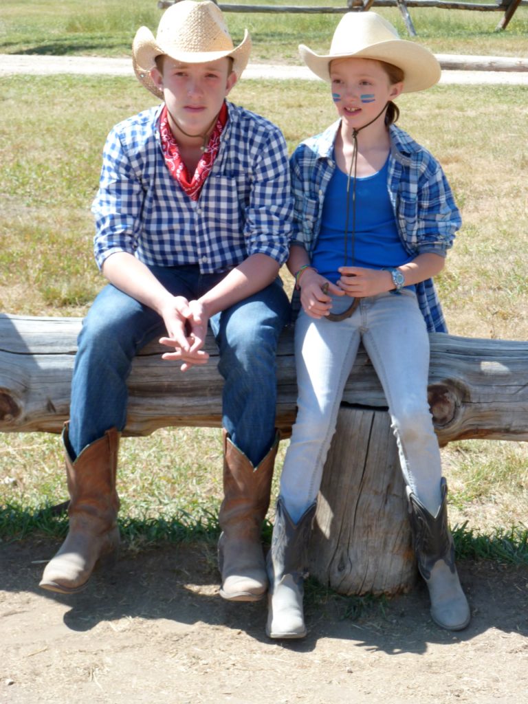 Family ranch holiday. Boy and girl in stetsons on Wyoming ranch. Copyright©2015 reserved to photographer. Contact mapandfamily.com