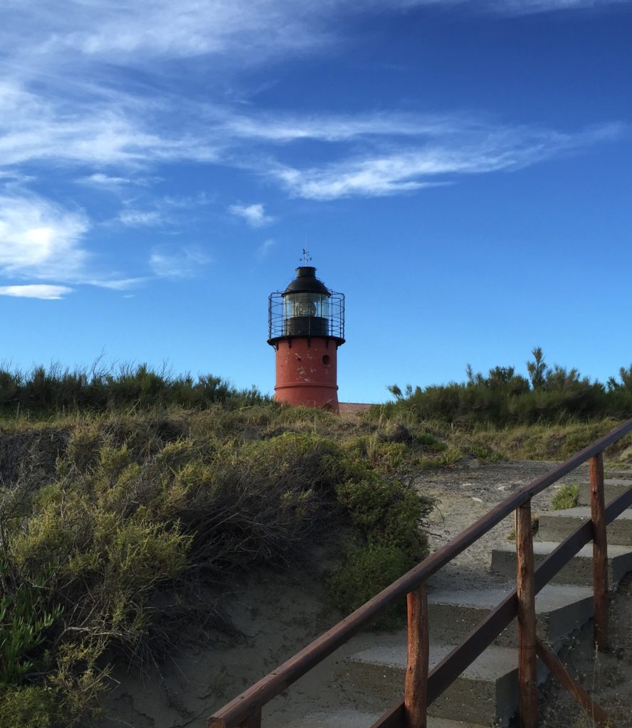 Argentina family holiday. Red lighthouse at Hotel Faro Punta Delgada de Campo. Copyright©2015 reserved to photographer. Contact mapandfamily.com