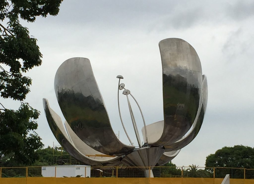 Argentina family holiday. Steel flower sculpture opens and closes. Buenos Aires. Copyright©2015 reserved to photographer. Contact mapandfamily.com