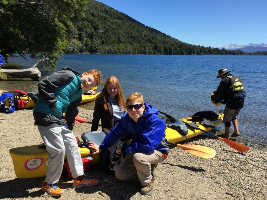 Family trip to Argentina: canoes at lakeside, Bariloche. Copyright © 2015 reserved to photographer. Contact mapandfamily.com