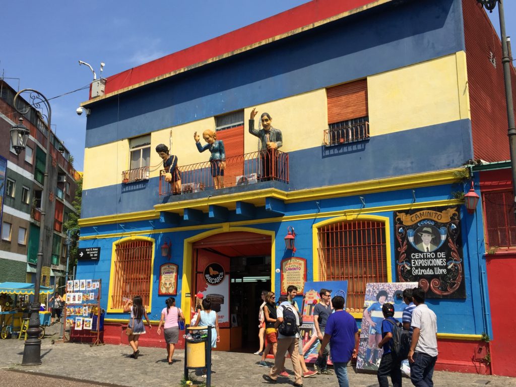 Argentina family holiday. Colourful buildings and figures in La Boca. Copyright©2015 reserved to photographer. Contact mapandfamily.com