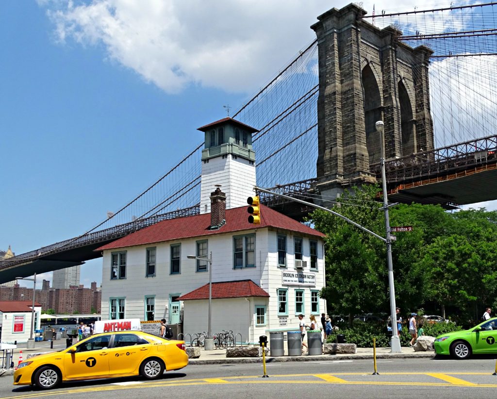 New York sightseeing with teens: ice-cream by Brooklyn Bridge. copyright ©2015 reserved to photographer. Contact mapandfamily.com