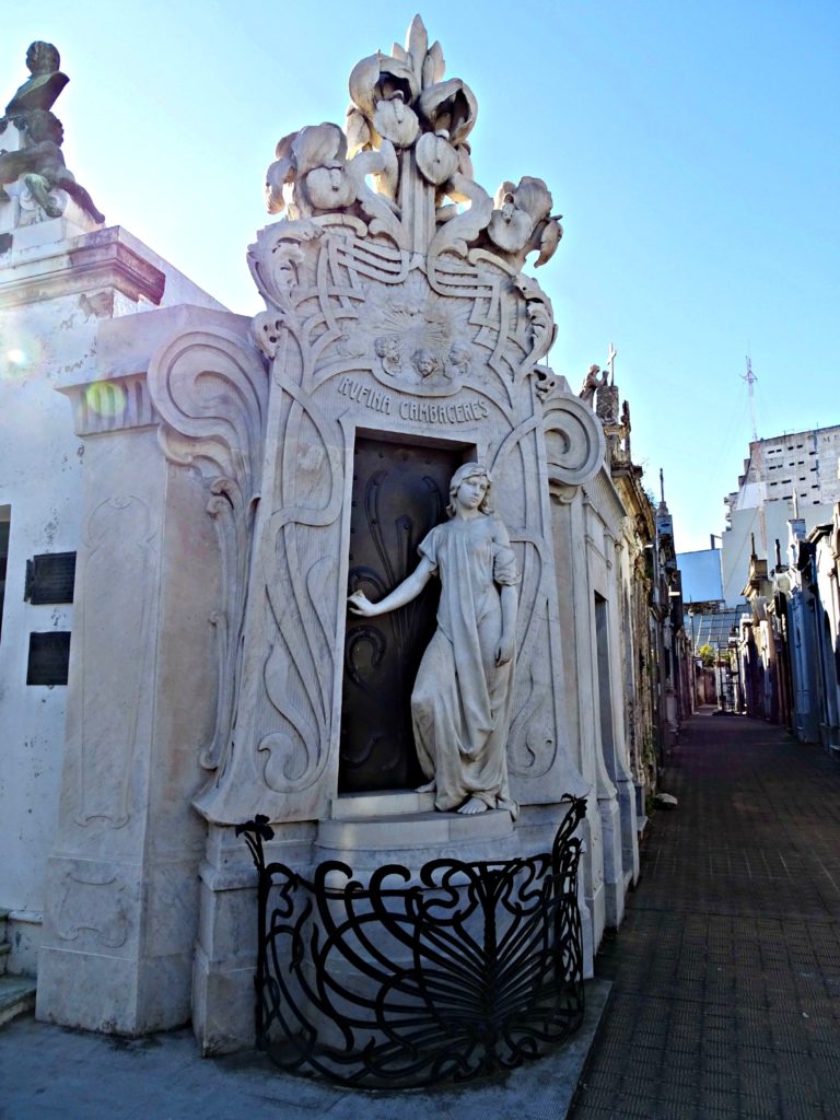 Buenos Aires with teens. Statue and intricate carving on a tomb in Recoleta. Copyright©2016 reserved to photographer. Contact mapandfamily.com 