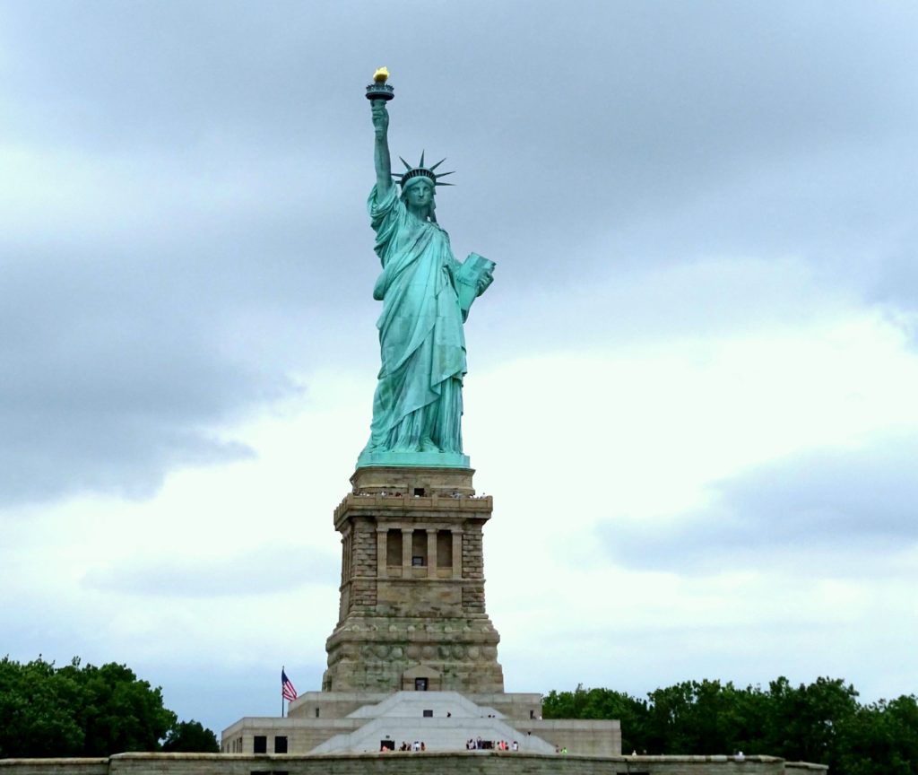 New York sightseeing with teens. View of Statue of Liberty and pedestal from the sea. copyright © 2015 reserved to photographer. Contact mapandfamily.com