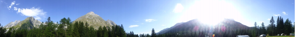 Family camping Swiss Alps wideangle view of mountains. Copyright©2015 reserved to photographer. Contact mapandfamily.com