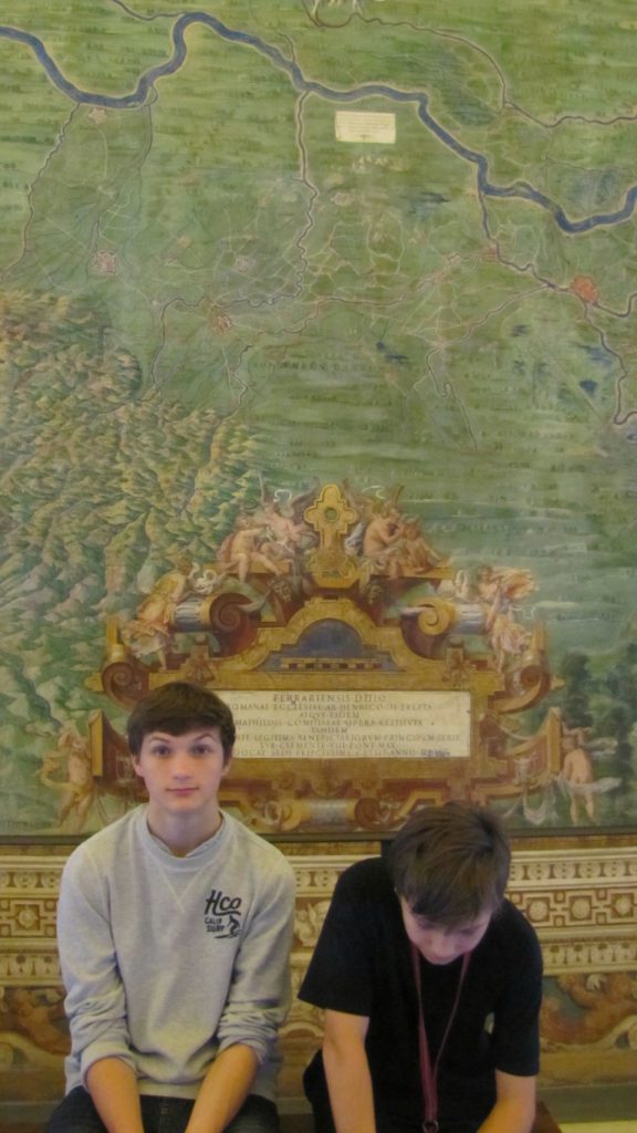 Visit the Vatican, boys sitting on a bench in the map gallery. Copyright©2016 reserved to photographer via mapandfamily.com