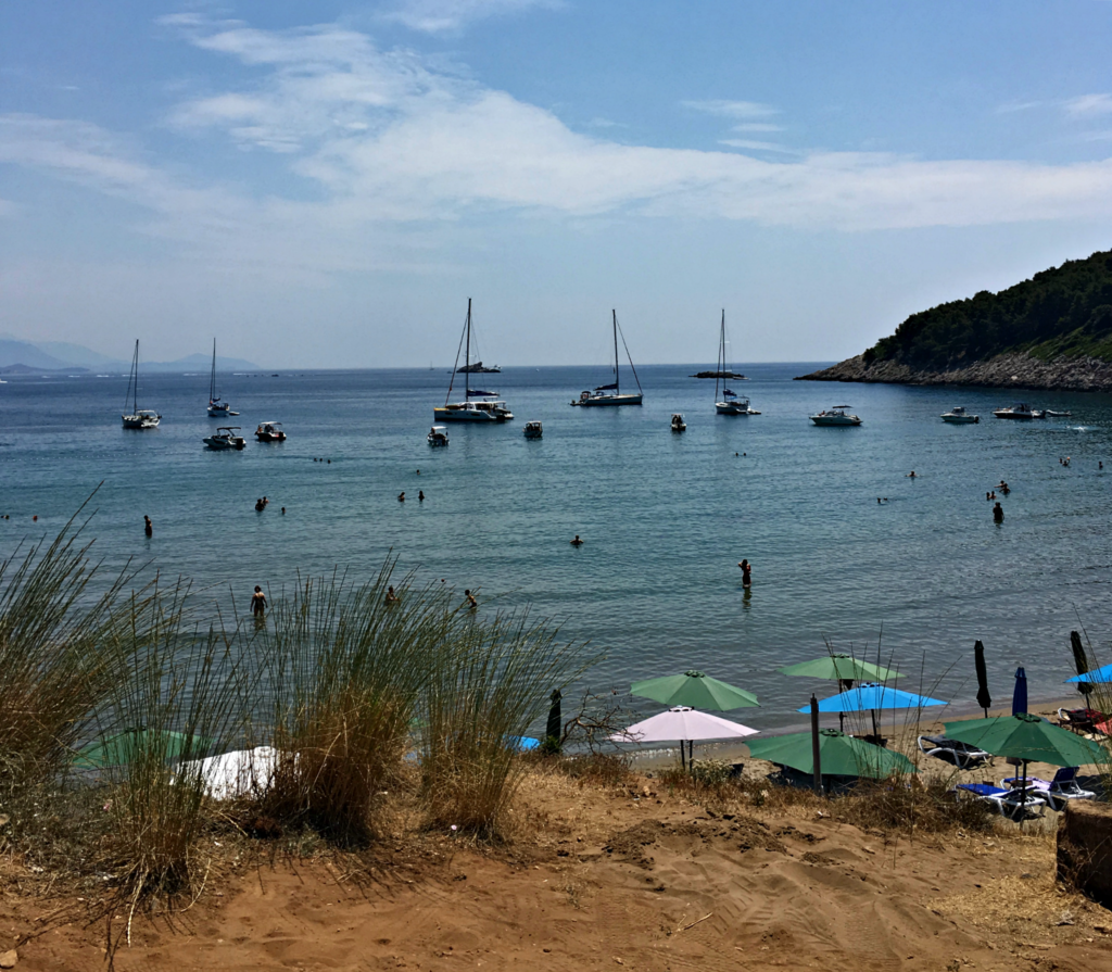 Dubrovnik beaches: sandy beach and boats on Lopud. Copyright©2017 mapandfamily.com