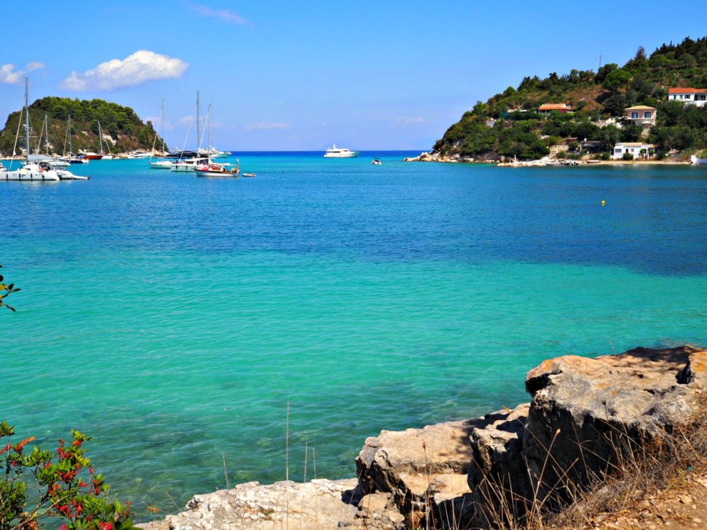 Ionian turquoise and blue sea in Lakka bay Paxos. Copyright © 2017 mapandfamily.com 