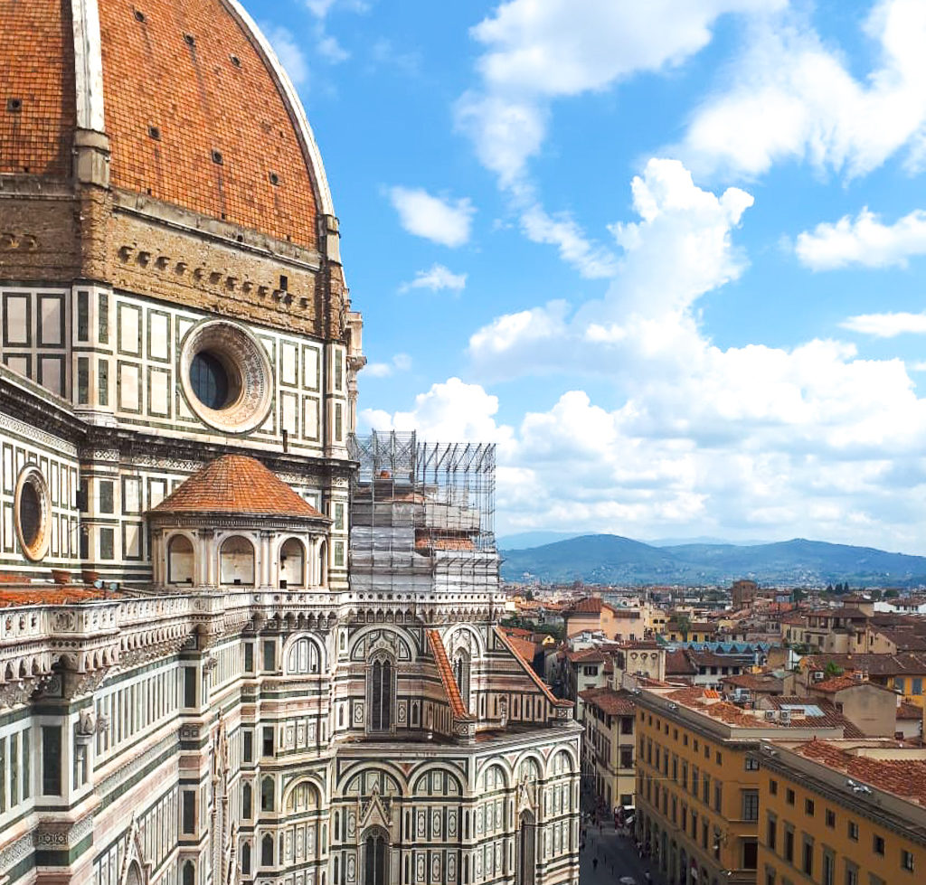 Climbing the Duomo, Florence. View of the cathedral complex and city and hills beyond. Copyright©2018 mapandfamily.com 