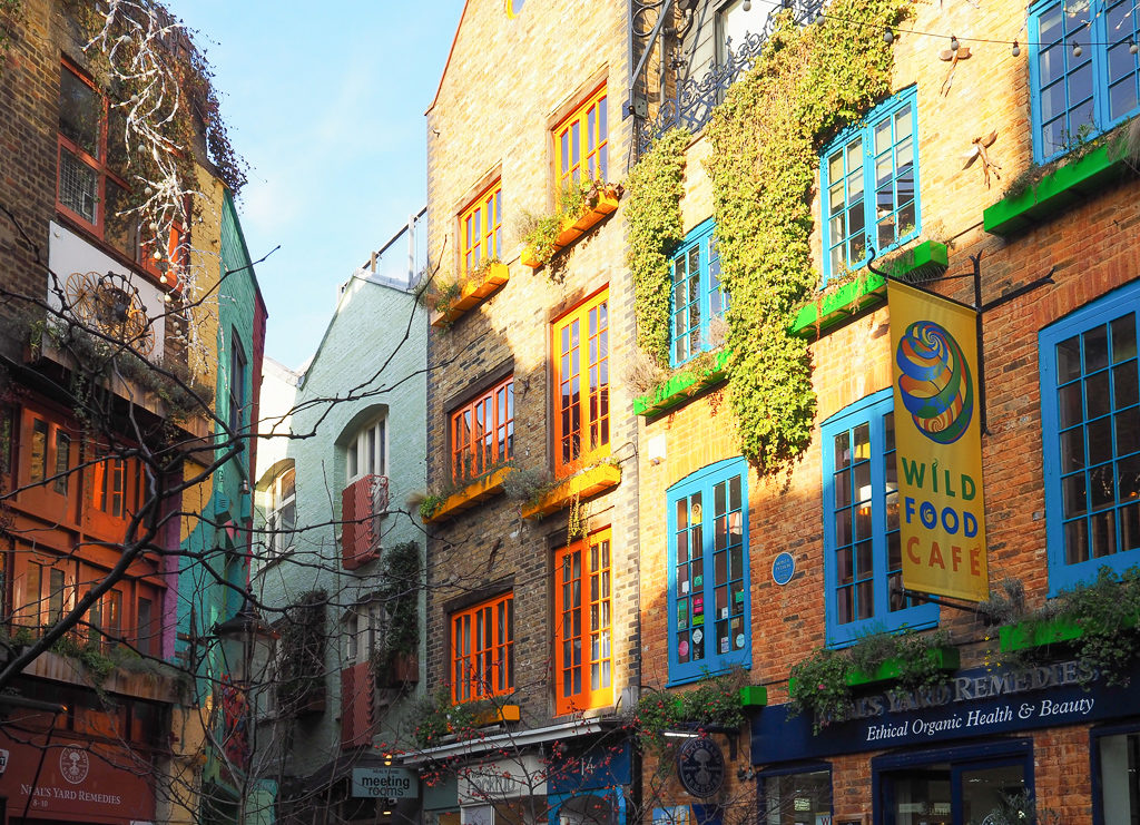 Colourful painted window frames in historic area of Covent Garden, London. Copyright ©2019 mapandfamily.com 