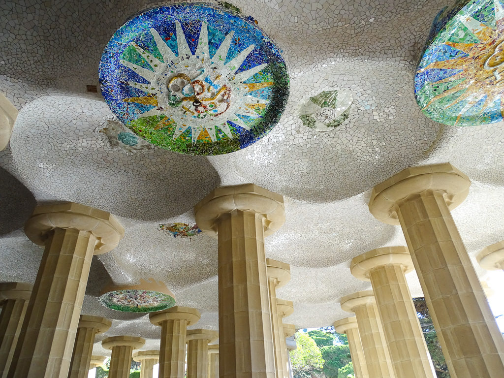 Gaudi colonnades in Park Guell. Copyright© 2019 mapandfamily.com 