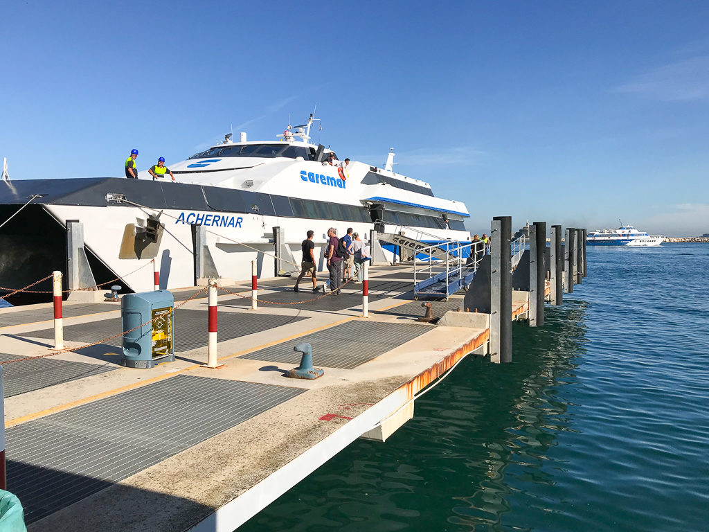 Day trip to Procida, Italy. Hydrofoil ferry Naples Procida at dock with people boarding it. Copyright©2019 mapandfamily.com 