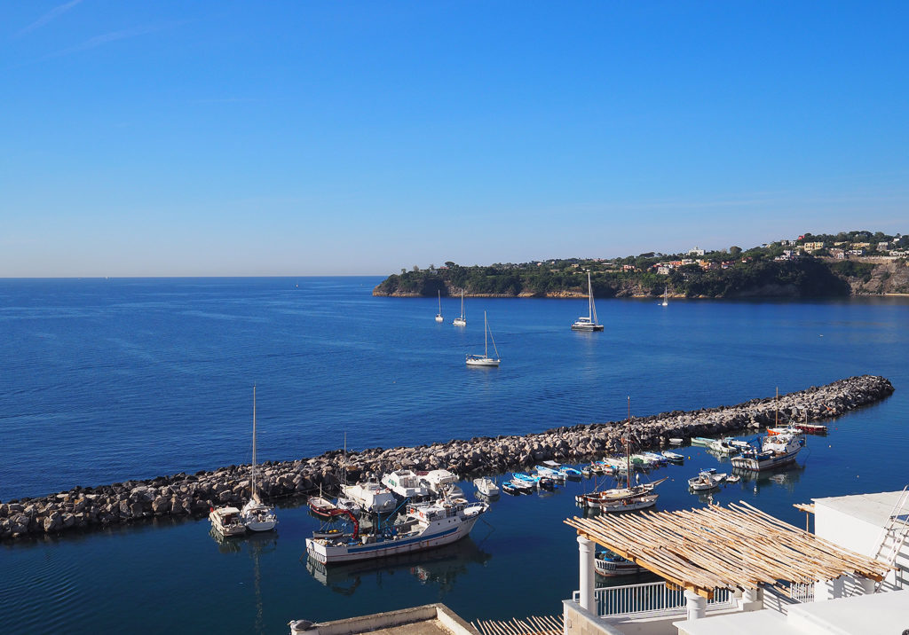 Boats in harbour of Corricella on Procida island. Copyright©2019 mapandfamily.com 