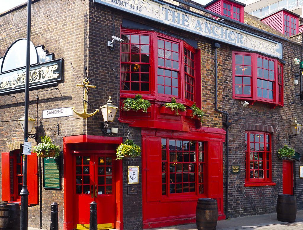 Historic Anchor pub with red painted doors and windows. Copyright ©2019 mapandfamily.com