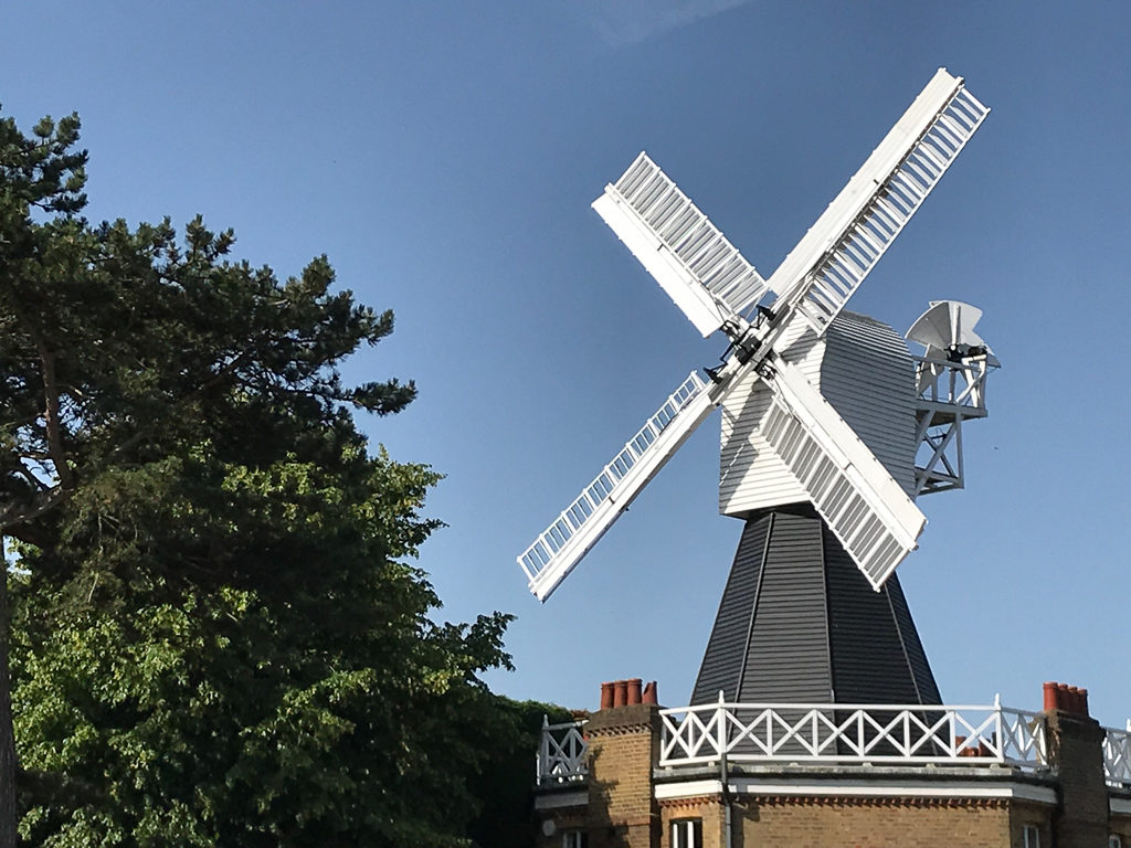 Windmill with white sails on Wimbledon common, London. Copyright ©2019 mapandfamily.com