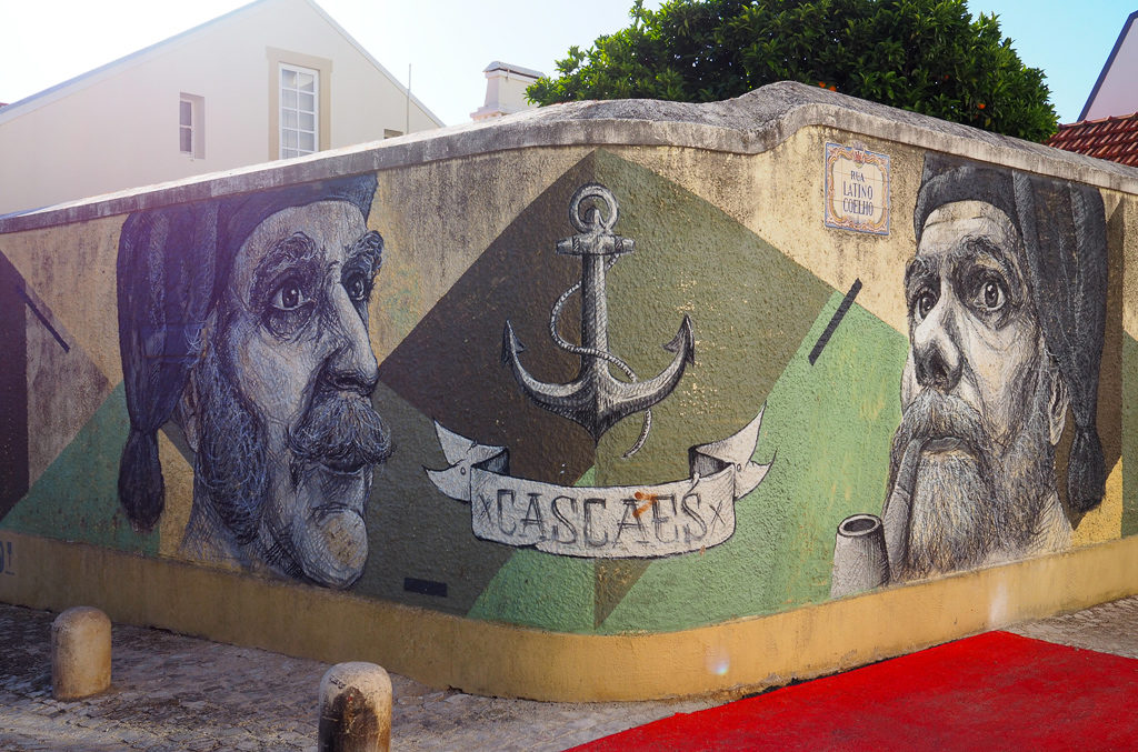 Street art image of sailors and anchor on wall in Cascais. Copyright ©2019 mapandfamily.com 