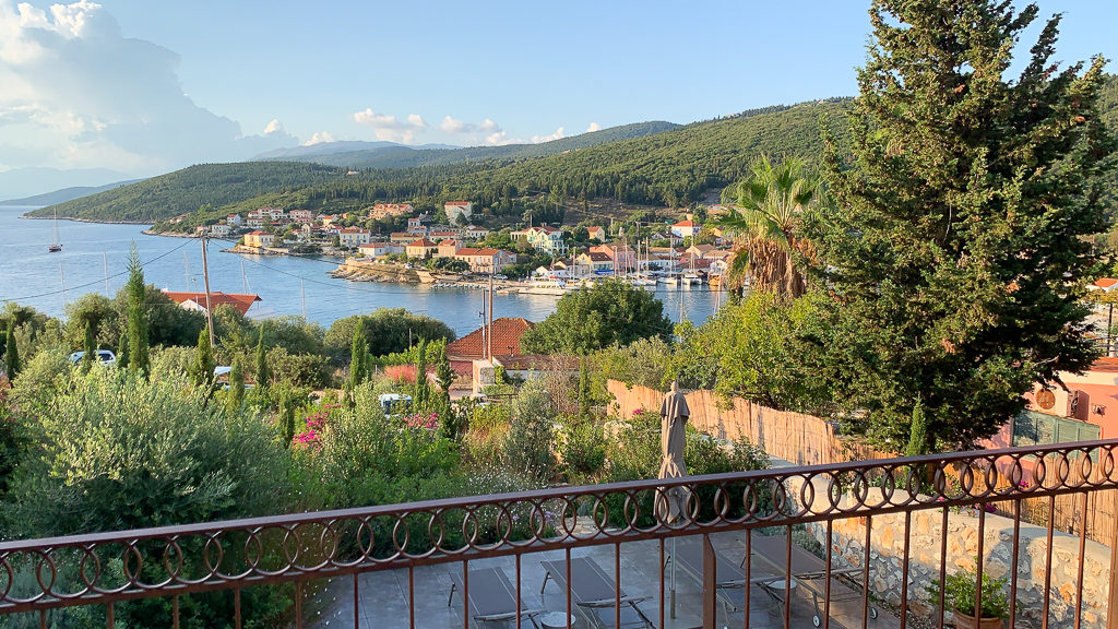 Fiskardo is one of the best places to stay in Kefalonia. View from balcony looking down on Fiscardo bay and village. Copyright©2019 mapandfamily.com 