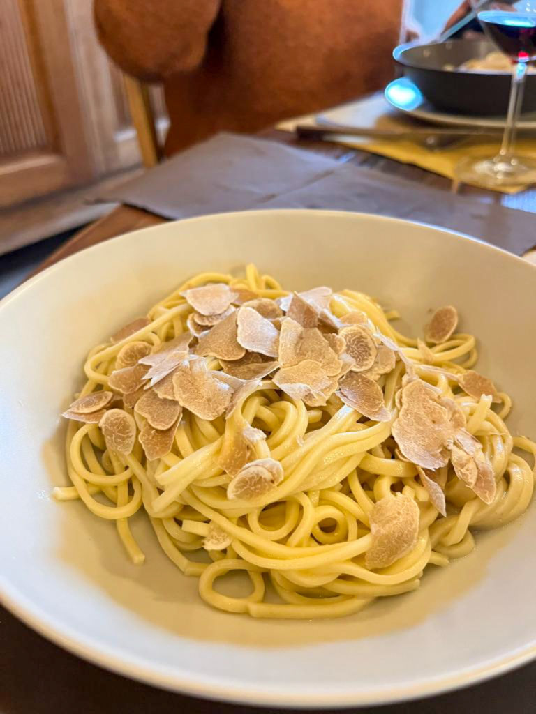 A plate of local pasta with shavings of truffle. Copyright @2022 reserved to the photographer via mapandfamily.com