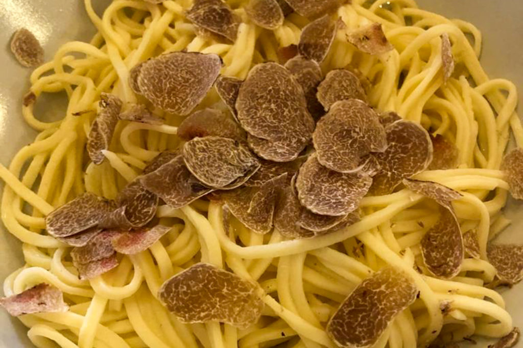 Truffle shavings on tajarin pasta. Copyright @2022 reserved to photographer via mapandfamily.com