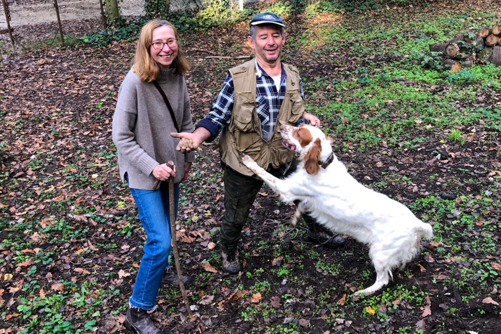 Truffle hunting in the woods. Two people and dog. Copyright @2022 reserved to photographer via mapandfamily.com