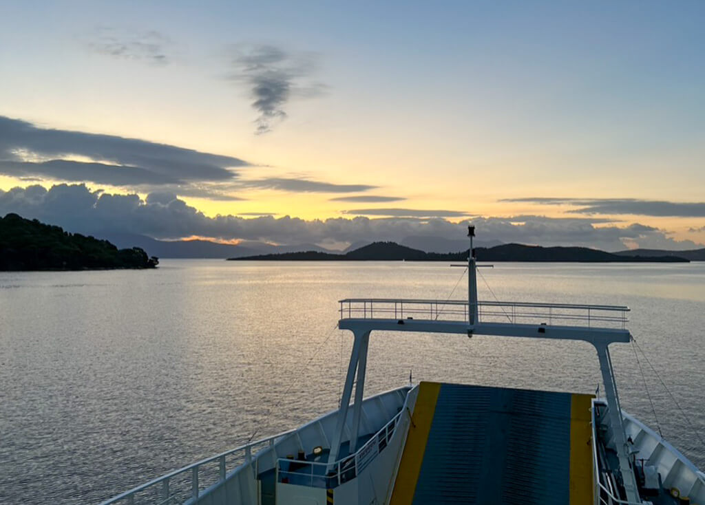 Meganisi ferry from Nidri at sunrise.Copyright@ 2022 mapandfamily.com