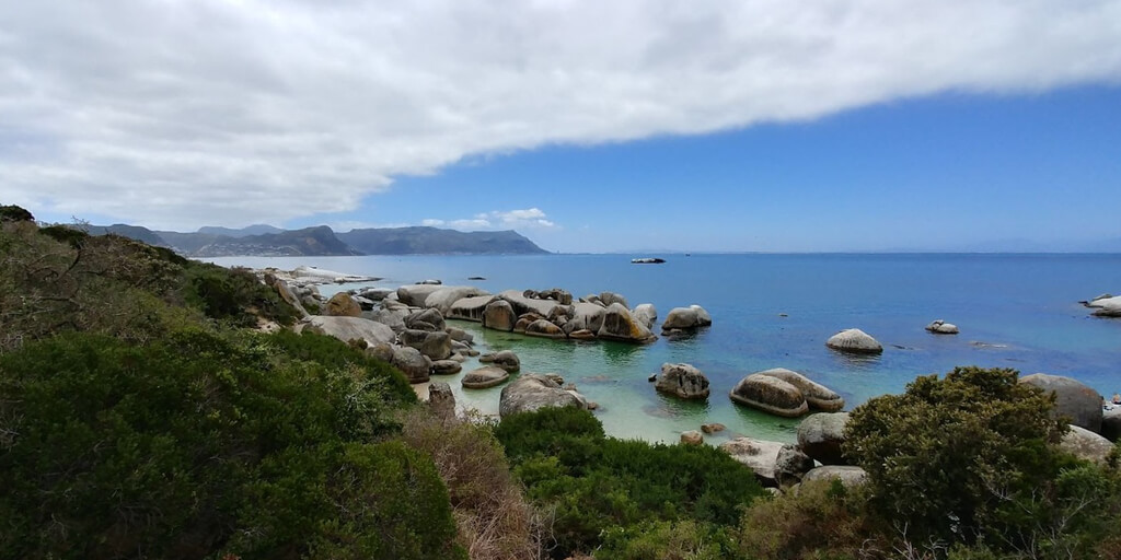 Large smooth boulders on the beach and in the water at Boulders Beach. Copyright@2023 reserved to photographer via mapandfamily.com