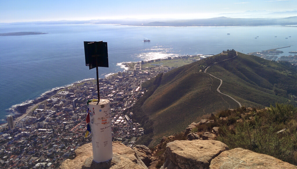 View of Cape Town below, the bay and the ridge of Signal Hill from top of Lion's Head. Copyright@2023 reserved to photographer via mapandfamily.com