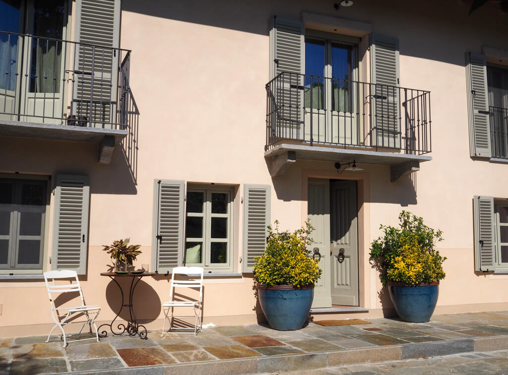 Entrance to Villa Giara Piedmont, showing metal balconies and french doors on Ist floor. Copyright@2023mapandfamily.com