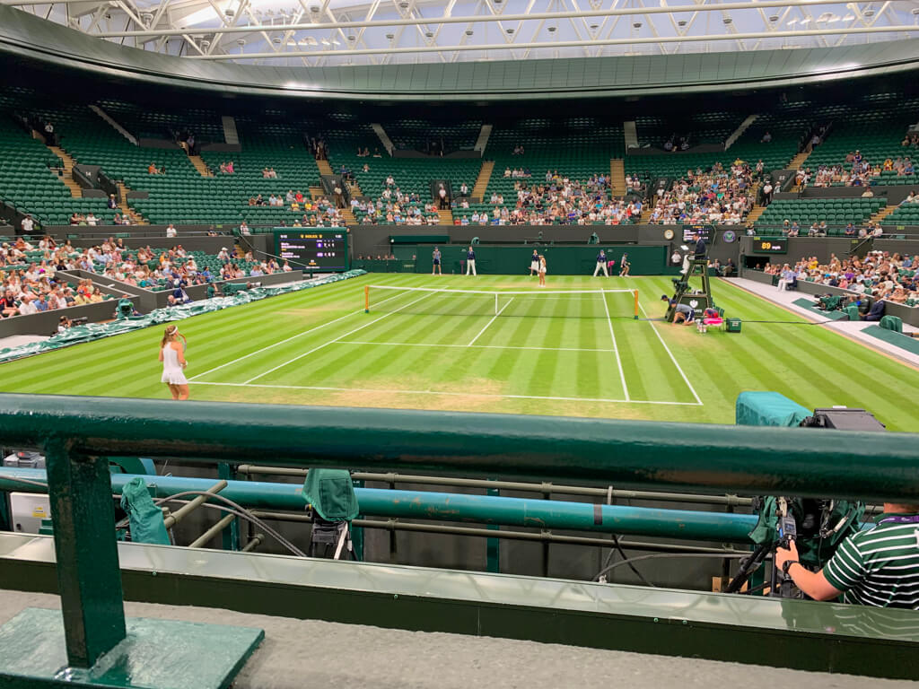 View of Wimbledon No. 1 grass court with roof closed and a ladies singles match in play. Copyright@2023mapandfamily.com 