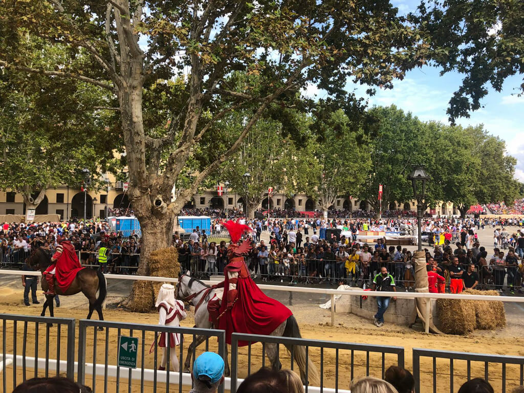 Parade of horses and jockeys in traditional dress around main square in Astil before palio. Copyright@2023 reserved to the photographer via mapandfamily.com