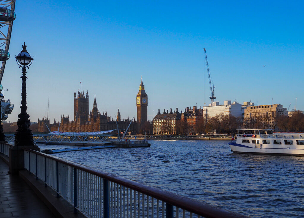 View of Big Ben and river against blue sky on winter morning. Copyright@2023 mapandfamily.com