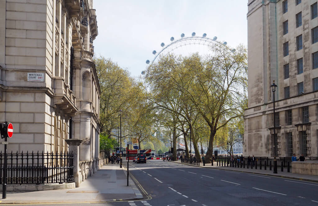 A bright but cloudy day in Whitehall with view of London Eye on opposite bank of river. Copyright@2024mapandfamily.com 