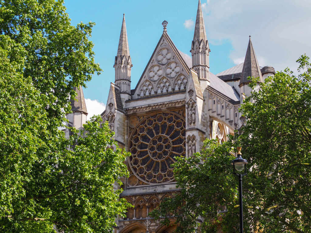 The oriel window of Westminster Abbey under blue skies in May in London Copyright@2024NancyRoberts