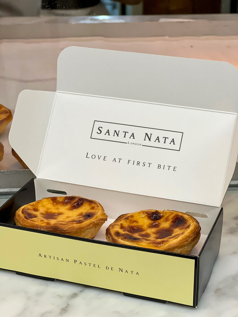 Smart cardboard box with two pastel de nata inside. Copyright@2024mapandfamily.com 