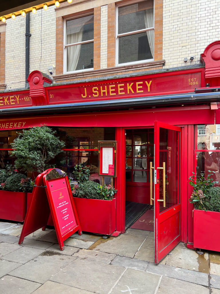 The red-painted exterior of J Sheekey in London's Theatreland. Copyright@2024NancyRoberts